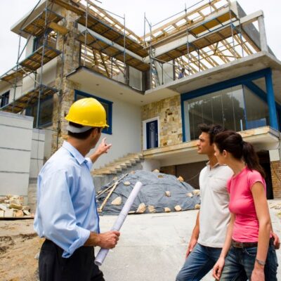 Custom Home Builder reviewing plans with clients Custom Home Builder reviewing plans with clients